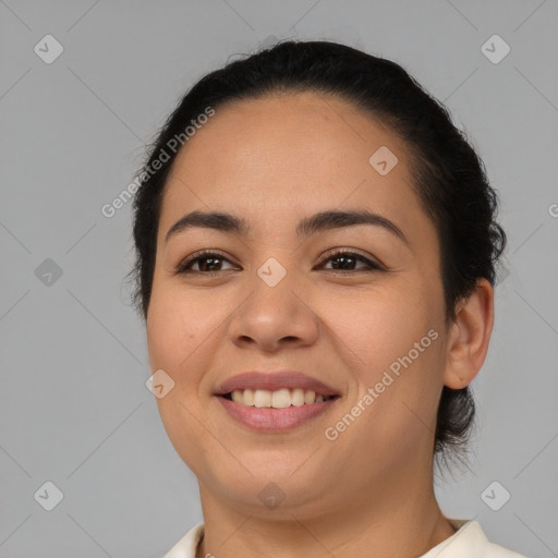 Joyful latino young-adult female with medium  black hair and brown eyes