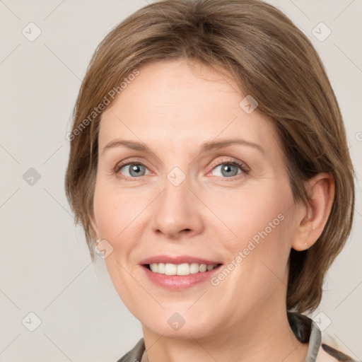 Joyful white adult female with medium  brown hair and grey eyes