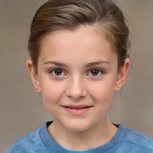 Joyful white child female with short  brown hair and brown eyes