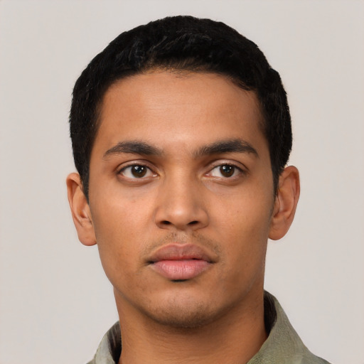 Neutral latino young-adult male with short  black hair and brown eyes