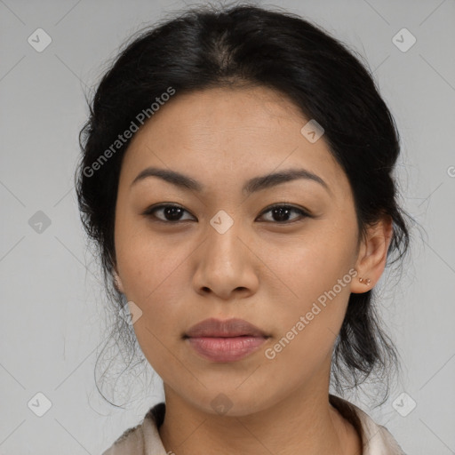 Joyful asian young-adult female with medium  black hair and brown eyes