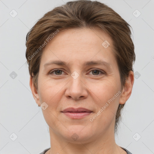 Joyful white adult female with short  brown hair and grey eyes