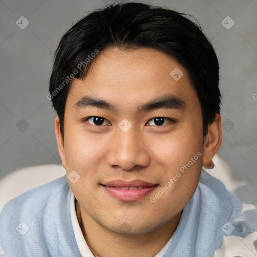 Joyful asian young-adult male with short  black hair and brown eyes