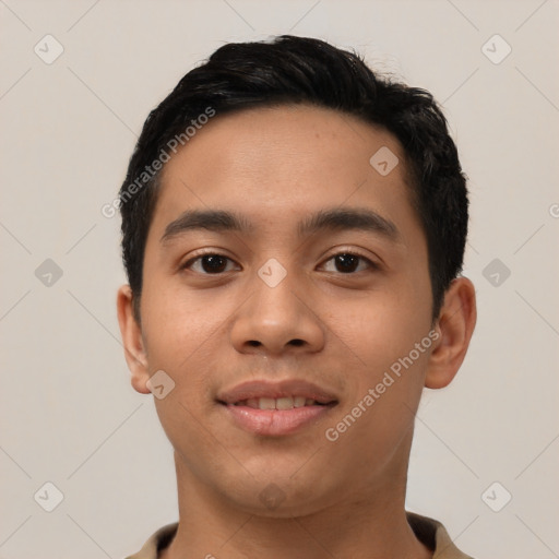 Joyful latino young-adult male with short  black hair and brown eyes