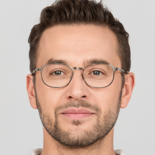 Joyful white adult male with short  brown hair and brown eyes