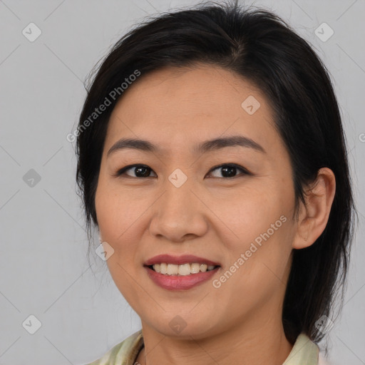 Joyful asian young-adult female with medium  brown hair and brown eyes