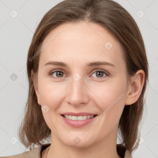 Joyful white young-adult female with medium  brown hair and grey eyes