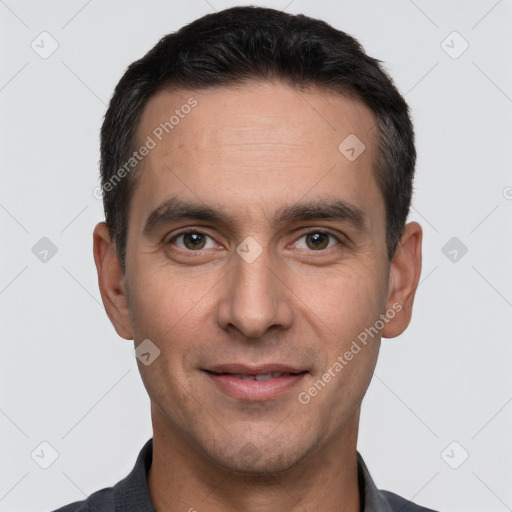 Joyful white young-adult male with short  black hair and brown eyes