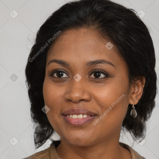 Joyful black adult female with medium  brown hair and brown eyes