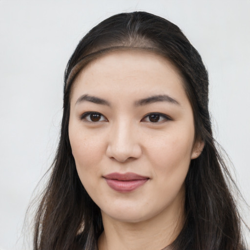 Joyful white young-adult female with long  black hair and brown eyes