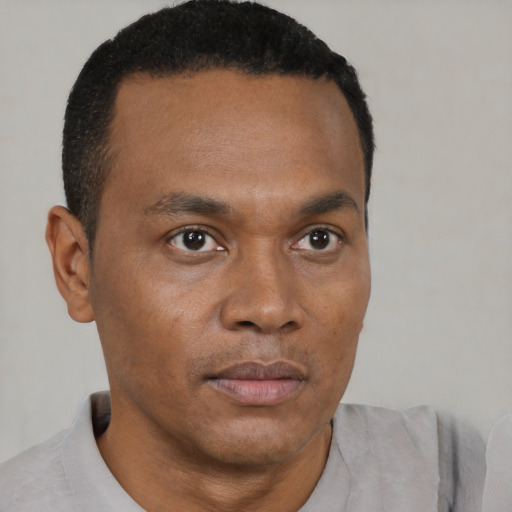 Neutral black young-adult male with short  brown hair and brown eyes