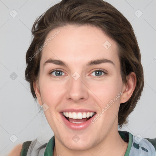 Joyful white young-adult female with medium  brown hair and green eyes