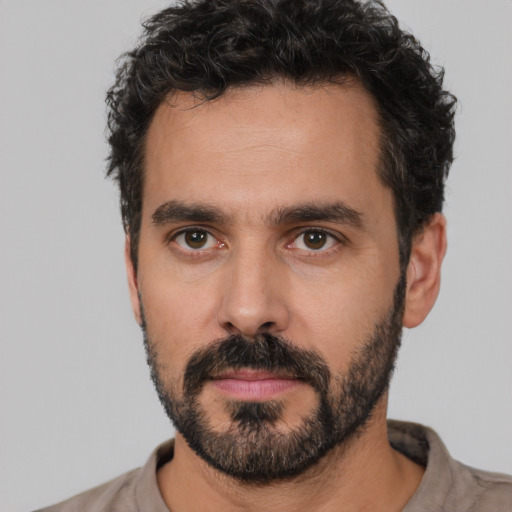 Neutral white young-adult male with short  black hair and brown eyes