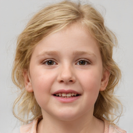 Joyful white child female with medium  brown hair and blue eyes