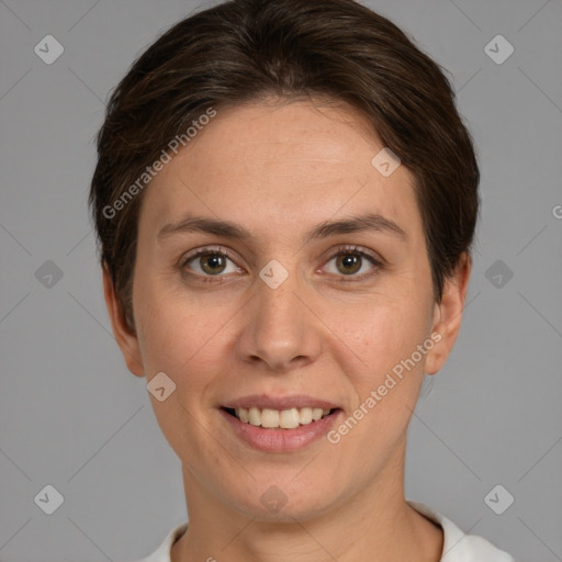 Joyful white young-adult female with short  brown hair and grey eyes