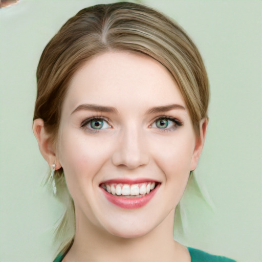 Joyful white young-adult female with medium  brown hair and green eyes