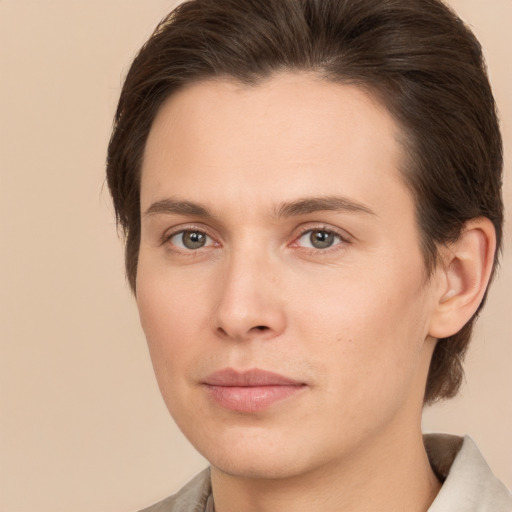 Joyful white young-adult male with medium  brown hair and brown eyes