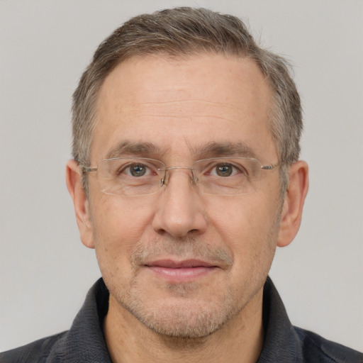 Joyful white middle-aged male with short  brown hair and brown eyes