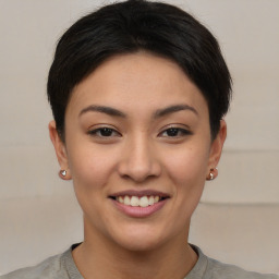 Joyful asian young-adult female with short  brown hair and brown eyes