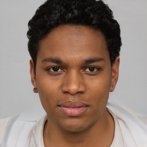 Neutral black young-adult male with short  black hair and brown eyes