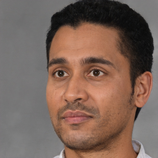 Neutral latino young-adult male with short  black hair and brown eyes