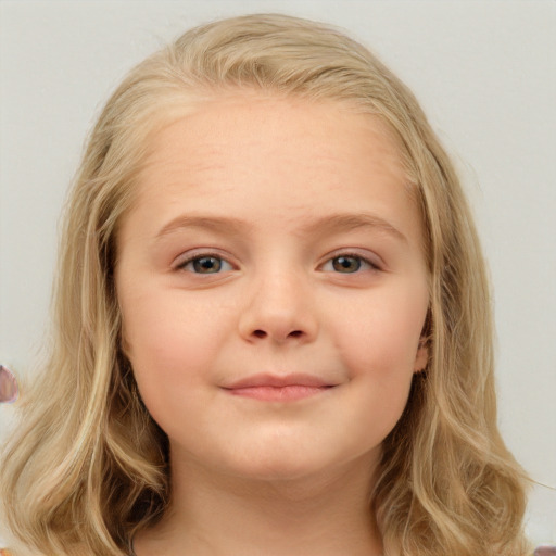 Joyful white child female with medium  brown hair and blue eyes