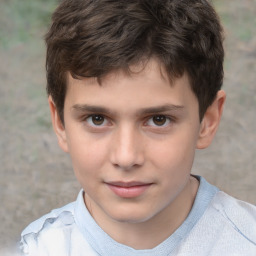 Joyful white child male with short  brown hair and brown eyes