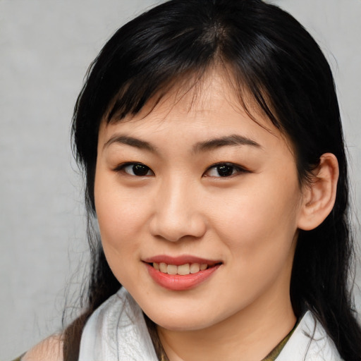 Joyful white young-adult female with medium  black hair and brown eyes