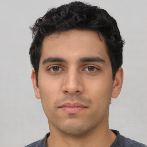 Neutral white young-adult male with short  black hair and brown eyes