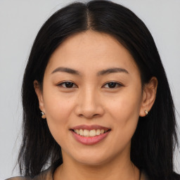 Joyful asian young-adult female with medium  brown hair and brown eyes