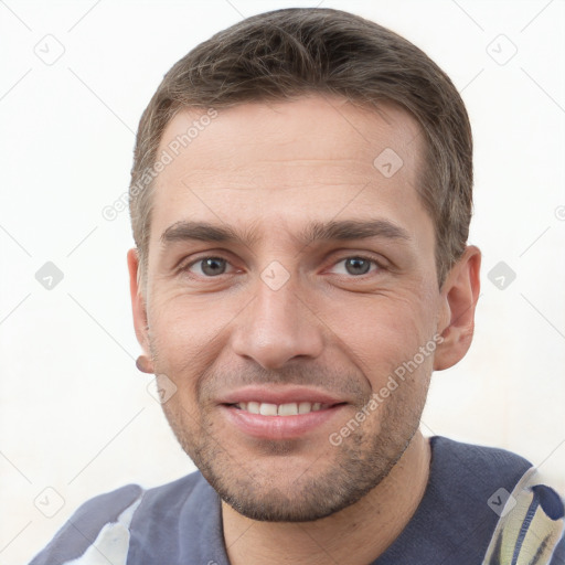 Joyful white young-adult male with short  brown hair and brown eyes