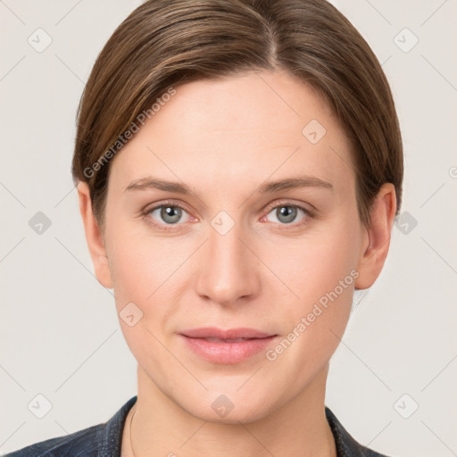 Joyful white young-adult female with short  brown hair and grey eyes