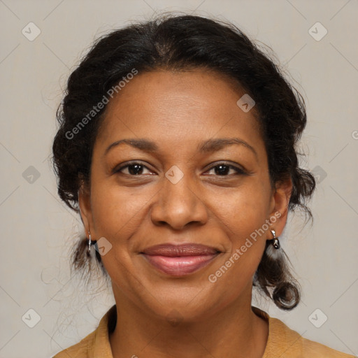 Joyful black adult female with medium  brown hair and brown eyes