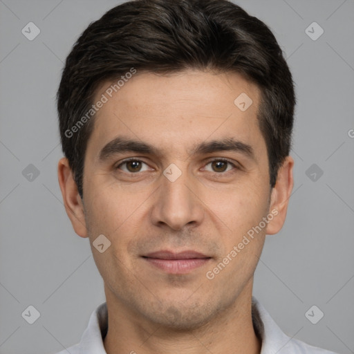 Joyful white young-adult male with short  brown hair and brown eyes