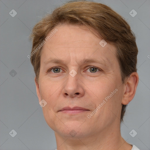 Joyful white adult female with short  brown hair and grey eyes