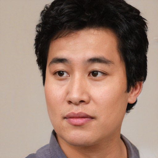 Neutral asian young-adult male with short  brown hair and brown eyes
