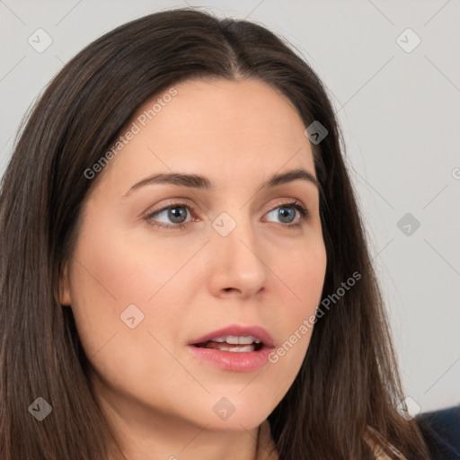 Neutral white young-adult female with long  brown hair and brown eyes