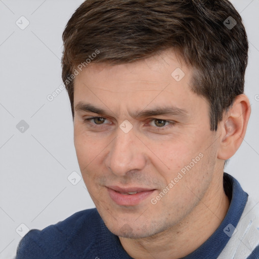 Joyful white adult male with short  brown hair and brown eyes