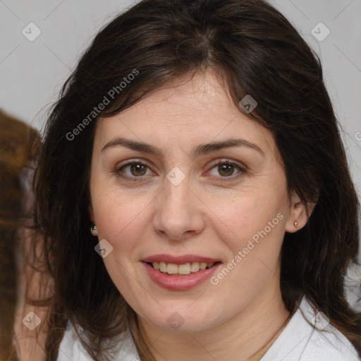 Joyful white adult female with medium  brown hair and brown eyes