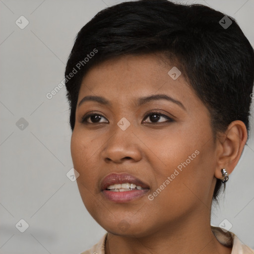 Joyful black young-adult female with medium  brown hair and brown eyes