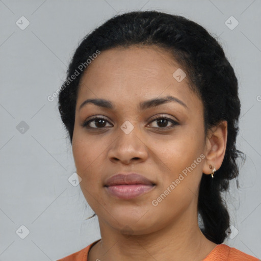 Joyful black young-adult female with medium  black hair and brown eyes