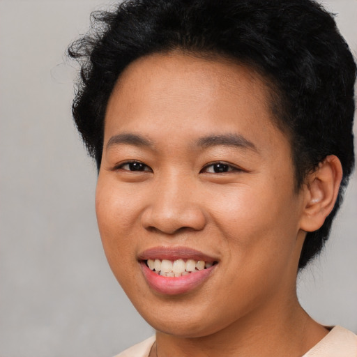 Joyful latino young-adult female with short  brown hair and brown eyes