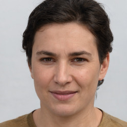 Joyful white adult female with short  brown hair and brown eyes