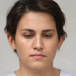 Neutral white young-adult female with short  brown hair and brown eyes