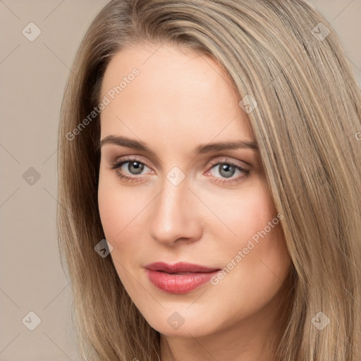 Neutral white young-adult female with long  brown hair and brown eyes