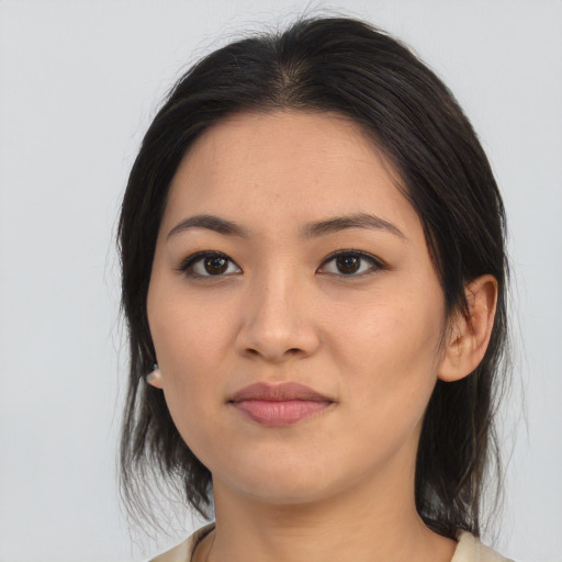 Joyful asian young-adult female with medium  black hair and brown eyes
