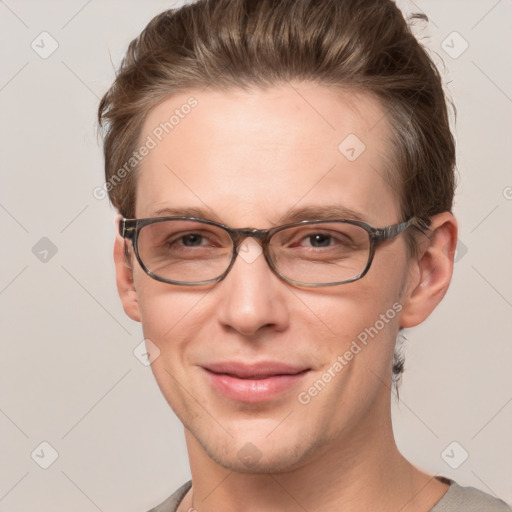 Joyful white adult male with short  brown hair and grey eyes