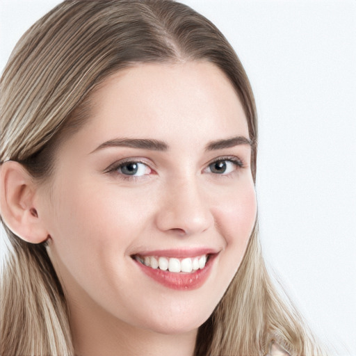 Joyful white young-adult female with long  brown hair and blue eyes