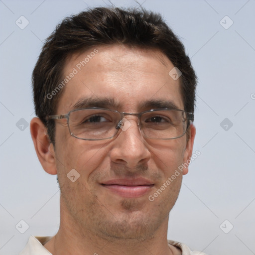 Joyful white adult male with short  brown hair and brown eyes