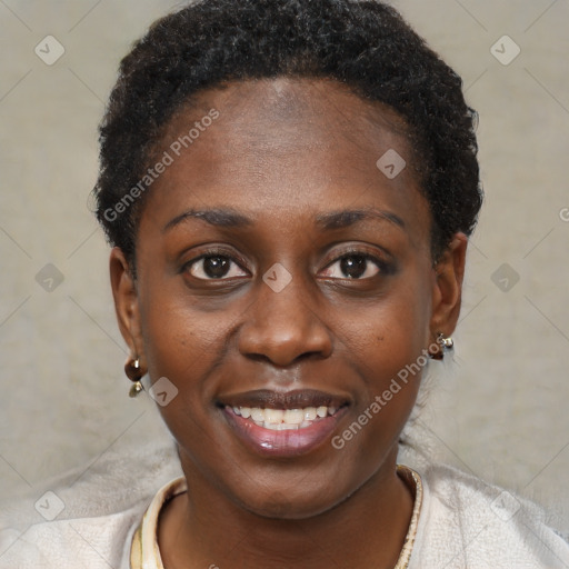 Joyful black young-adult female with short  brown hair and brown eyes